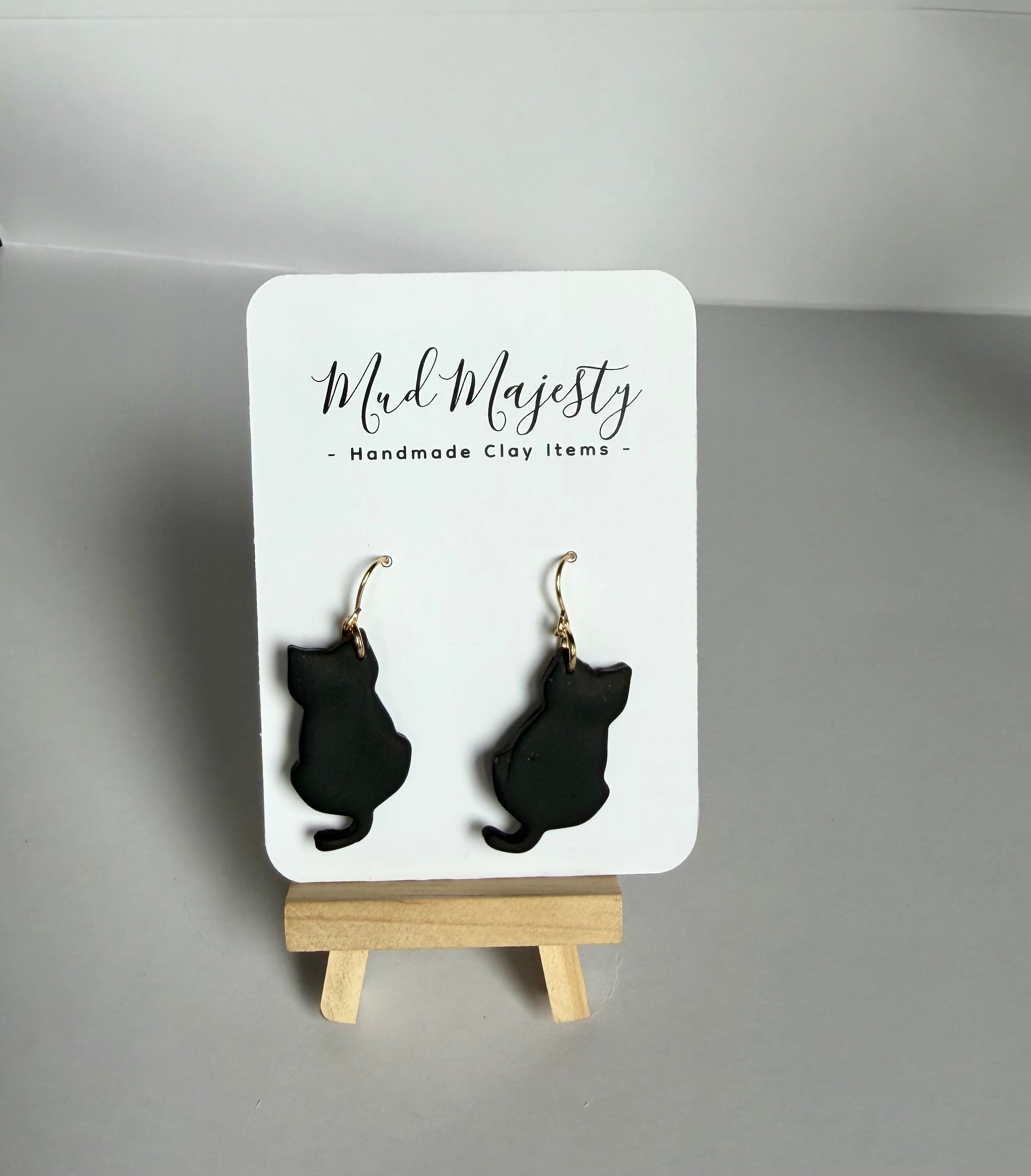 Black cat gold dangle earrings